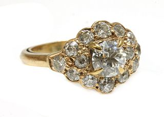 A lozenge shaped diamond cluster ring,