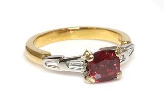 A two colour gold single stone red spinel ring,