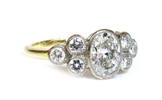 Property of a Lady. A two colour gold seven stone diamond ring,