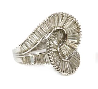 A Continental white gold diamond set entwined loop ring,