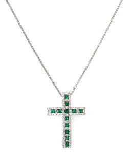 An 18ct white gold emerald and diamond Latin style cross,