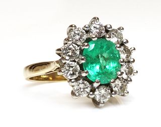 An 18ct gold emerald and diamond cluster ring,