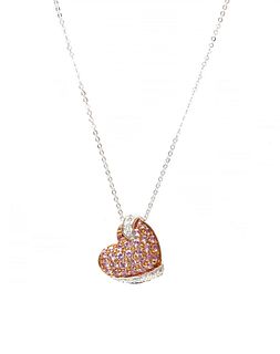 A pink sapphire and diamond heart pendant, retailed by Thurlow Champness,