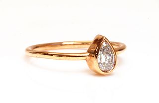A rose gold single stone pear cut diamond ring,