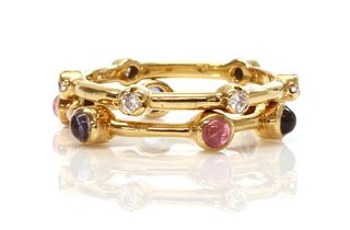 Two gold diamond and gem set stacking rings, by Ilias Lalaounis,