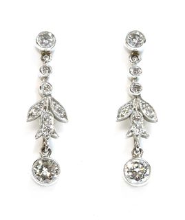 A pair of platinum diamond drop earrings,