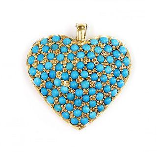 A turquoise set heart shaped pendant/enhancer,