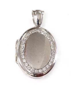 An 18ct white gold diamond set hinged locket, by Charles Green,