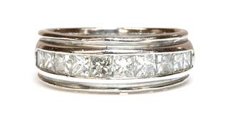 An 18ct white gold diamond half eternity ring,