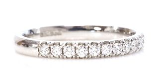 An 18ct white gold diamond set half eternity ring,