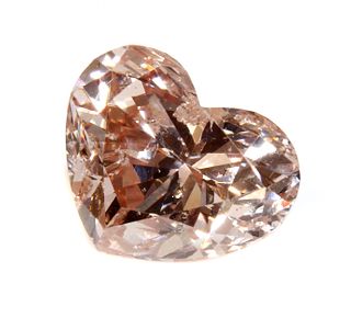 An unmounted fancy pink heart shaped brilliant cut diamond,