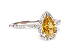 A platinum fancy orange-yellow diamond and diamond halo cluster ring,