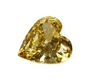 An unmounted fancy yellow heart shaped brilliant cut diamond,
