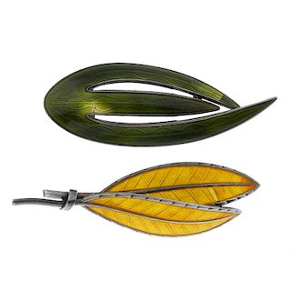 Two designer enamel brooches. The first by Ivar Holt, designed as two yellow guilloche enamel leaves