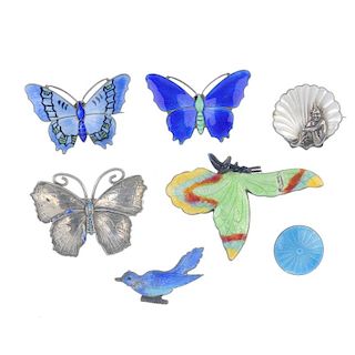 Seven enamel brooches. To include a Bernard Instone brooch designed as an imp sitting in front of a
