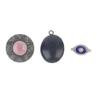 A selection of jewellery. To include a bar brooch, the central domed resin panel with dog detail ben