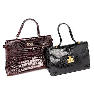 Three leather handbags. To include a smooth burgundy leather bag by Cellerini Firenze, featuring a s