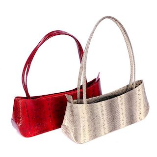 Two snake skin shoulder bags of the same design. With a stiff structured long rectangular shape, top