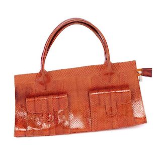Two dyed snake skin bags. To include an orange coloured structured handbag, featuring duel top handl