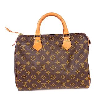 LOUIS VUITTON - a Speedy 30. Designed with maker's iconic monogram coated canvas exterior with natur