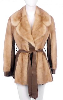 A pearl mink and leather jacket. Designed with protective leather panels and cuffs, a fitted waist a