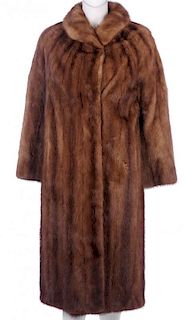 A full-length pastel mink coat. Designed with a short lapel collar, hook and eye clip fastenings, tw