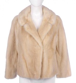 A pearl mink jacket. Designed with a notched lapel collar, hook and eye fastenings, two small side v