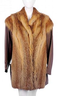 A 1980's oversized red fox fur and leather jacket. Designed with a lapel collar, padded shoulders, b