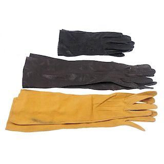 Fourteen pairs of gloves. The majority of gloves made from leather and suede in a variety of colours