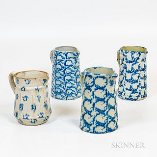 Four Blue and White Sponged Stoneware Pitchers