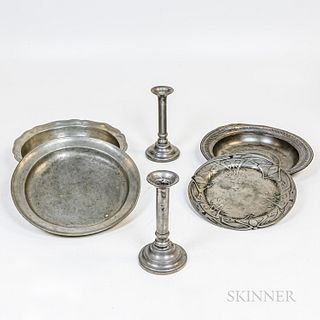 Four Pewter Dishes and a Pair of Pewter Candlesticks