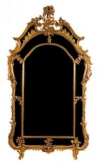 A Louis XV Style Giltwood Pier Mirror Height 89 x width 49 inches.