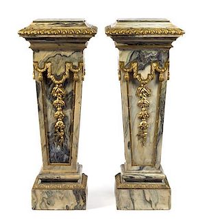 A Pair of Continental Gilt Bronze Mounted Marble Pedestals Height 44 1/2 x width 17 1/2 x depth 17 1/2 inches.