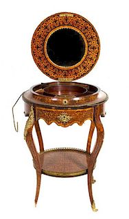 A Louis XV Style Gilt Bronze Mounted Marquetry Work Table Height 30 x diameter of top 24 inches.