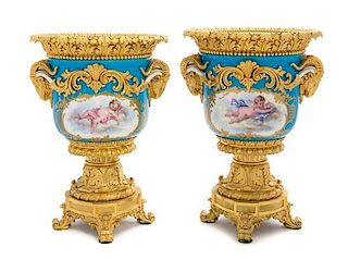 A Pair of Gilt Bronze Mounted Sevres Porcelain Urns Height 10 1/2 inches.