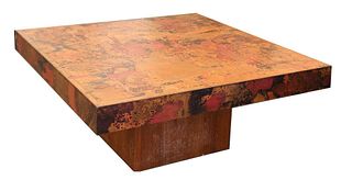 A teak and copper mounted coffee table,