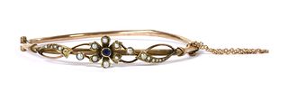 An Edwardian gold sapphire and split pearl bangle,