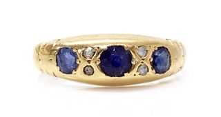 An Edwardian 18ct gold sapphire and diamond ring,