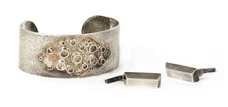 A handmade sterling silver torque bangle,