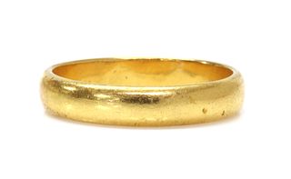 A 22ct gold 'D' section wedding ring,