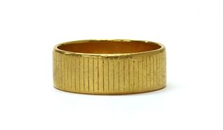 A 22ct gold flat section wedding ring,