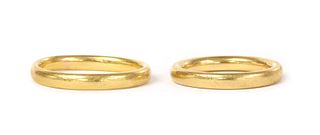 Two 22ct gold court section wedding rings,