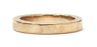 A gold flat section wedding ring,