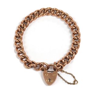 A gold hollow curb link bracelet,