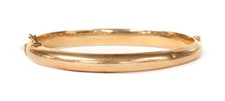 A 15ct gold oval hollow hinged bangle,