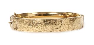 A 9ct gold oval hollow hinged bangle, by Smith & Pepper,