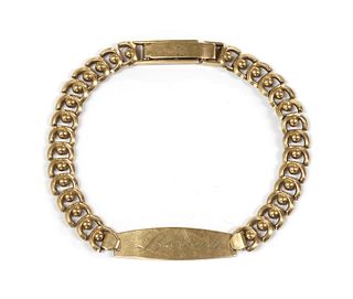 A gold identity bracelet,