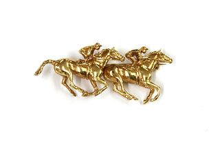 A 9ct gold racehorse brooch, by Harriet Glen,