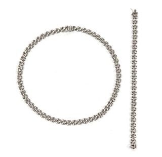 A 9ct white gold panther link necklace and bracelet suite,