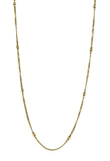 A gold bead and curb link chain,